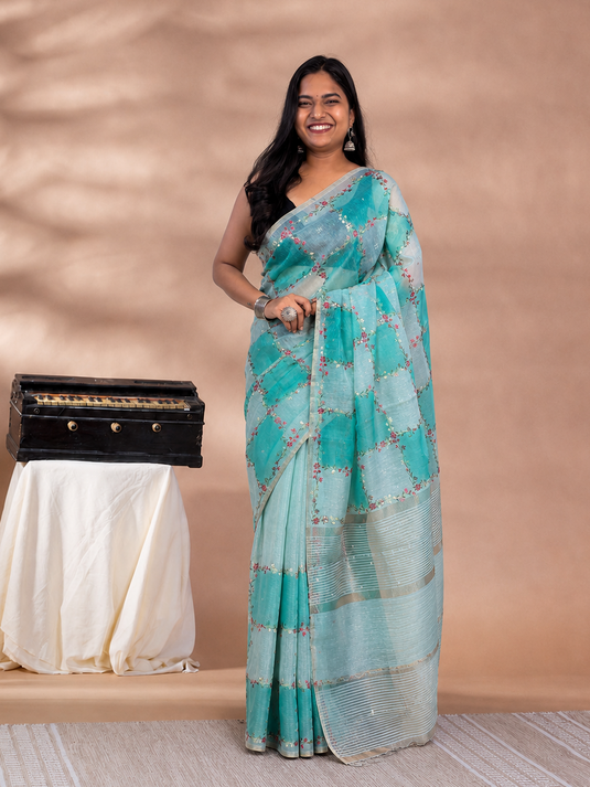 Teal Linen Tissue Embroidered saree